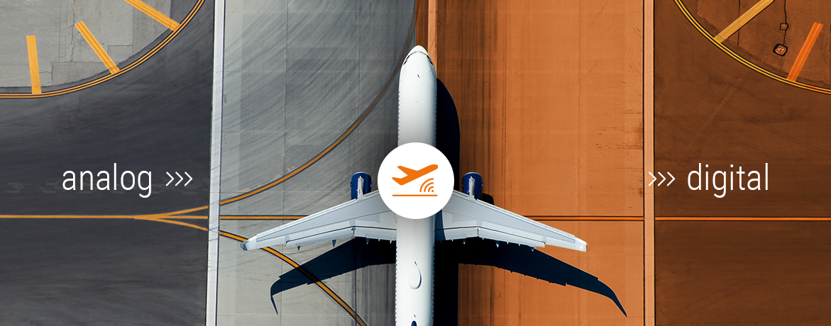 Aerial view of narrow body aircraft departing airport runway.